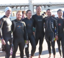 Hypercat athlete group photo wearing wetsuits at Ironman Arizona